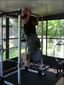Drew Baye performing strict chin ups with 90 pounds